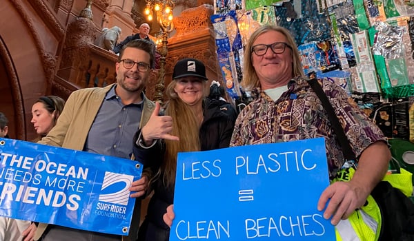 Surfrider members standing with advocacy signs in Albany